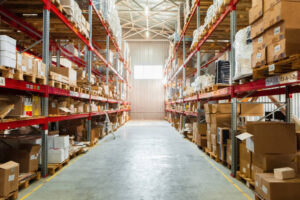 Modern warehouse shelves with pile of cardboard boxes. Close up.